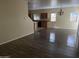 Open dining area with hardwood-style flooring and kitchen views at 2431 N 83Rd Dr, Phoenix, AZ 85037