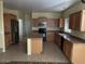 Spacious kitchen featuring an island, stainless steel appliances, and ample cabinetry at 2431 N 83Rd Dr, Phoenix, AZ 85037