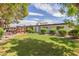 Spacious backyard with grassy area, playground, and mature trees at 250 E Voltaire Ave, Phoenix, AZ 85022