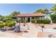 Inviting home exterior with landscaped walkway, lush greenery, and a charming garden statue at 250 E Voltaire Ave, Phoenix, AZ 85022