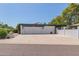 White single story home with two car garage and large driveway at 250 E Voltaire Ave, Phoenix, AZ 85022