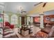 Open living area with leather sofas, a coffee table, and a pool table at 250 E Voltaire Ave, Phoenix, AZ 85022