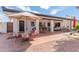 Outdoor patio with seating, umbrella, and brick pavers at 250 E Voltaire Ave, Phoenix, AZ 85022