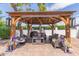 Relaxing backyard pergola with comfortable seating and decorative accents at 250 E Voltaire Ave, Phoenix, AZ 85022