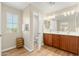 Double vanity bathroom with a separate toilet area at 25719 N 54Th Dr, Phoenix, AZ 85083