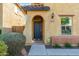 Front entryway with dark gray door and landscaped walkway at 25719 N 54Th Dr, Phoenix, AZ 85083