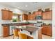 Modern kitchen with granite countertops, stainless steel appliances, and an island at 25719 N 54Th Dr, Phoenix, AZ 85083