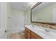 Bathroom with double sinks, a large mirror, and a tub at 29061 N Cactus Cir, San Tan Valley, AZ 85143