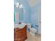 Light blue bathroom with a single sink vanity and toilet at 29061 N Cactus Cir, San Tan Valley, AZ 85143