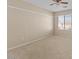 Spacious bedroom featuring neutral tones, carpet flooring and a large window at 29061 N Cactus Cir, San Tan Valley, AZ 85143