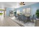 Light and airy dining room with a light wood table and blue chairs at 29061 N Cactus Cir, San Tan Valley, AZ 85143