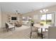 Inviting living room features a built-in media center, comfortable seating, and an adjacent dining area at 29061 N Cactus Cir, San Tan Valley, AZ 85143