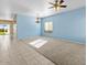 Living room with light blue walls, carpeted floor, and ceiling fan at 29061 N Cactus Cir, San Tan Valley, AZ 85143