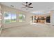 Bright, open living room leads to the kitchen, featuring large windows and a sliding door at 29061 N Cactus Cir, San Tan Valley, AZ 85143