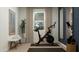 Home gym with Peloton bike, mirrors and plenty of floor space at 29411 N 31St Ln, Phoenix, AZ 85083