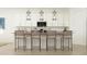 Kitchen island with seating for four and modern pendant lighting at 3178 W Peak View Rd, Phoenix, AZ 85083