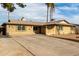 Brick home with a two car driveway and desert landscaping at 3808 W Mission Ln, Phoenix, AZ 85051