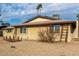 Brick home with a ladder and rock landscaping at 3808 W Mission Ln, Phoenix, AZ 85051