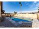 Large kidney shaped pool in a sunny backyard at 3808 W Mission Ln, Phoenix, AZ 85051