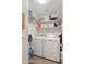 Laundry room with washer, dryer, and storage shelves at 3830 E Lakewood Pkwy # 1166, Phoenix, AZ 85048