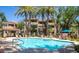 Sparkling community pool and spa surrounded by palm trees at 3830 E Lakewood Pkwy # 1166, Phoenix, AZ 85048