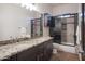 Bathroom with double sinks and a walk-in shower at 39005 N 11Th Ave, Phoenix, AZ 85086