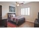 Cozy bedroom with a queen-size bed and wood floors at 39005 N 11Th Ave, Phoenix, AZ 85086