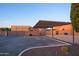 Covered parking area with shade structure and desert landscaping at 39005 N 11Th Ave, Phoenix, AZ 85086