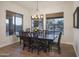 Bright dining room with large table and backyard view at 39005 N 11Th Ave, Phoenix, AZ 85086