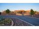 Front view of a beautiful home with a circular driveway at 39005 N 11Th Ave, Phoenix, AZ 85086