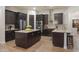 Gourmet kitchen with large island and granite counters at 39005 N 11Th Ave, Phoenix, AZ 85086