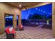 Covered patio with seating area overlooking the backyard at 39005 N 11Th Ave, Phoenix, AZ 85086