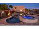 Inviting pool and spa with night lighting and landscaping at 39005 N 11Th Ave, Phoenix, AZ 85086