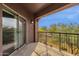 Private balcony overlooking a tree-lined landscape at 3935 E Rough Rider Rd # 1076, Phoenix, AZ 85050