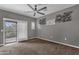 Bright bedroom with carpet flooring, sliding door to balcony and ceiling fan at 3935 E Rough Rider Rd # 1076, Phoenix, AZ 85050