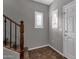 Inviting entryway with tiled floor, staircase, and plantation shutters at 3935 E Rough Rider Rd # 1076, Phoenix, AZ 85050