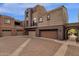 Three-story building with attached garages and courtyard at 3935 E Rough Rider Rd # 1076, Phoenix, AZ 85050