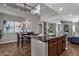 Kitchen island with granite countertop and seating for four at 3935 E Rough Rider Rd # 1076, Phoenix, AZ 85050