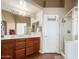 Double vanity bathroom with large shower and tiled floors at 3946 E Pollack St, Phoenix, AZ 85042