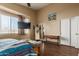 Bright bedroom with wood floors, large window, and ceiling fan at 3946 E Pollack St, Phoenix, AZ 85042