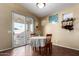 Cozy breakfast nook with table and chairs near sliding door at 3946 E Pollack St, Phoenix, AZ 85042