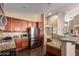 Well-equipped kitchen with stainless steel appliances and island at 3946 E Pollack St, Phoenix, AZ 85042