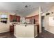 Kitchen boasts ample cabinetry, stainless steel appliances, and an island at 3946 E Pollack St, Phoenix, AZ 85042