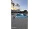 Community pool with lounge chairs and shade structures at 3946 E Pollack St, Phoenix, AZ 85042