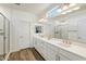 Double vanity bathroom with a large mirror, shower and linen closet at 4026 E Madre Del Oro Dr, Cave Creek, AZ 85331