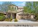 Two-story house with a three-car garage and landscaped front yard at 4026 E Madre Del Oro Dr, Cave Creek, AZ 85331