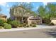 Two-story house with a three-car garage and nicely landscaped front yard at 4026 E Madre Del Oro Dr, Cave Creek, AZ 85331