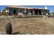 Hot tub and patio area with a retaining wall and mountain views at 45239 N 16Th St, New River, AZ 85087