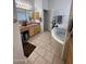 Bathroom with large corner tub, double vanity, and tile floor at 45239 N 16Th St, New River, AZ 85087