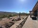 Covered patio with mountain views and a flagstone walkway at 45239 N 16Th St, New River, AZ 85087